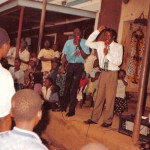 Elijah Preaching with his brother Pastor David Kyeyune in Busia Market, Uganda.